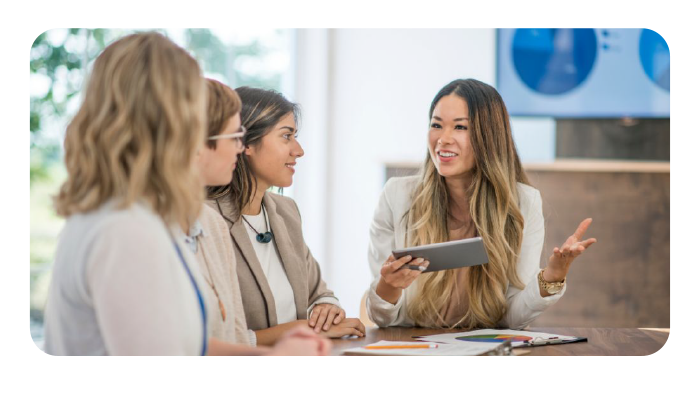 Business meeting with team members collaborating at a table